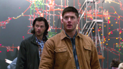 Sam and Dean look around Cas' headquarters.